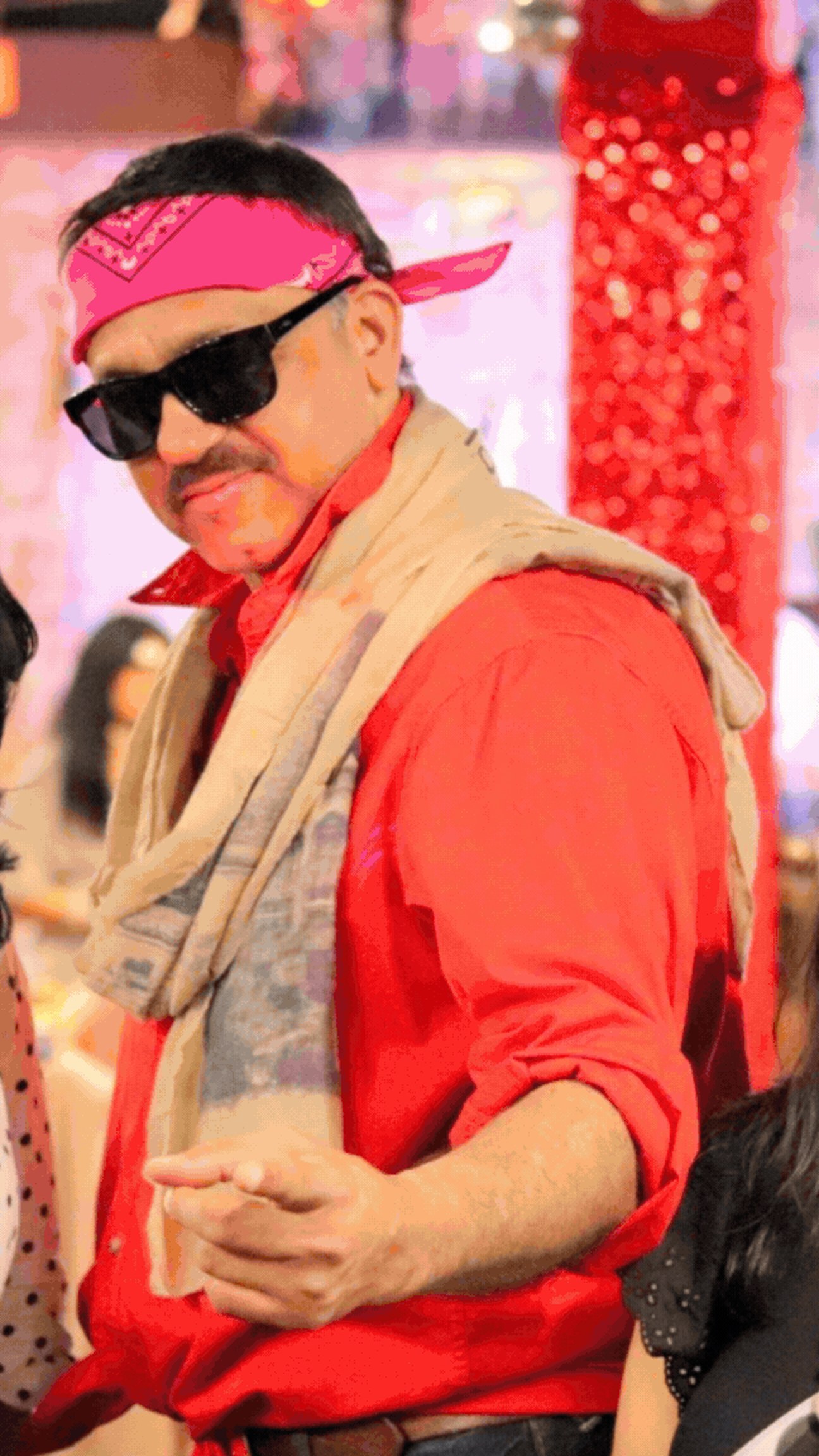 Best dressed retro winner in a red shirt, pink bandana, dark sunglasses and a patterned scarf
