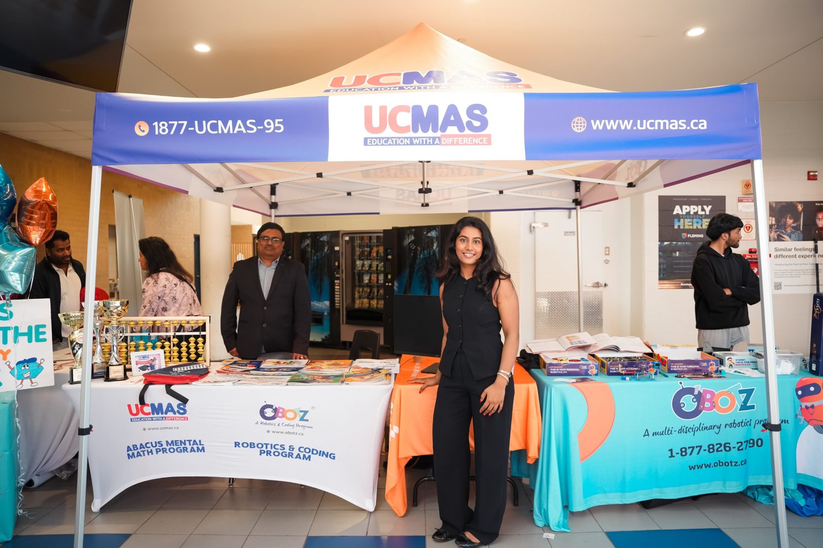 The UCMAS abacus mental maths and OBOTZ robotics and coding booth with trophies and learning kits